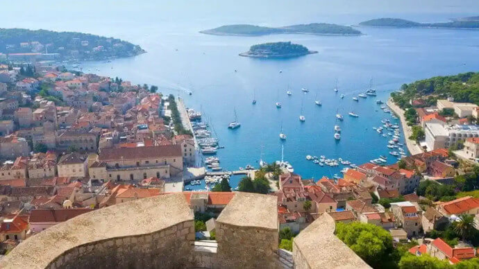 Panoramic view of Hvar town and its harbor from the Hvar Fortress, a highlight of the Blue Cave & Hvar Tour from Split