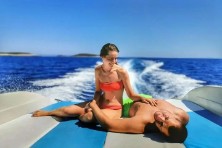 Couple sunbathing on sunbed during speedboat tour from Split